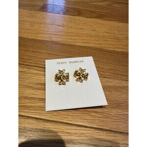 Tory Burch earring card with tag and blue velvet dust bag.
18k gold plated rol